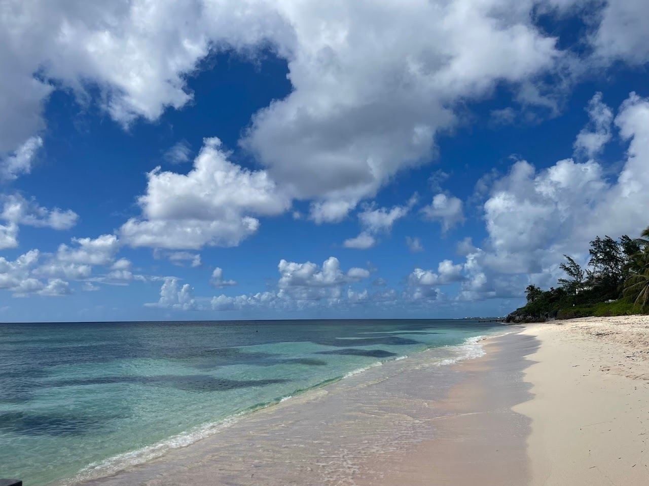 The quiet South Sound shore and reef sheltered water at Spotts Beach Grand Cayman