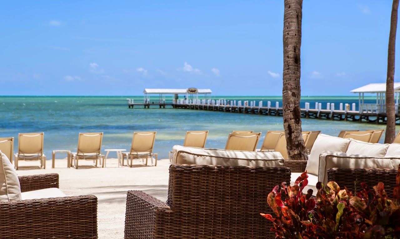 Palms and loungers on the private oceanfront sand at Cheeca Lodge and Spa in Islamorada