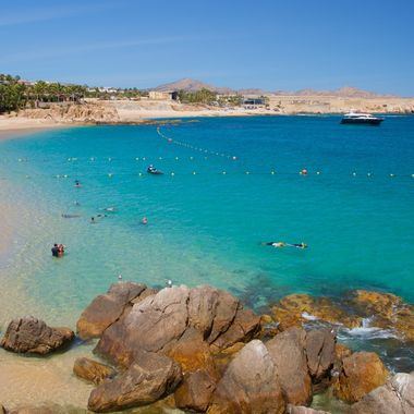 The sheltered sand and clear water of Chileno Bay in Los Cabos