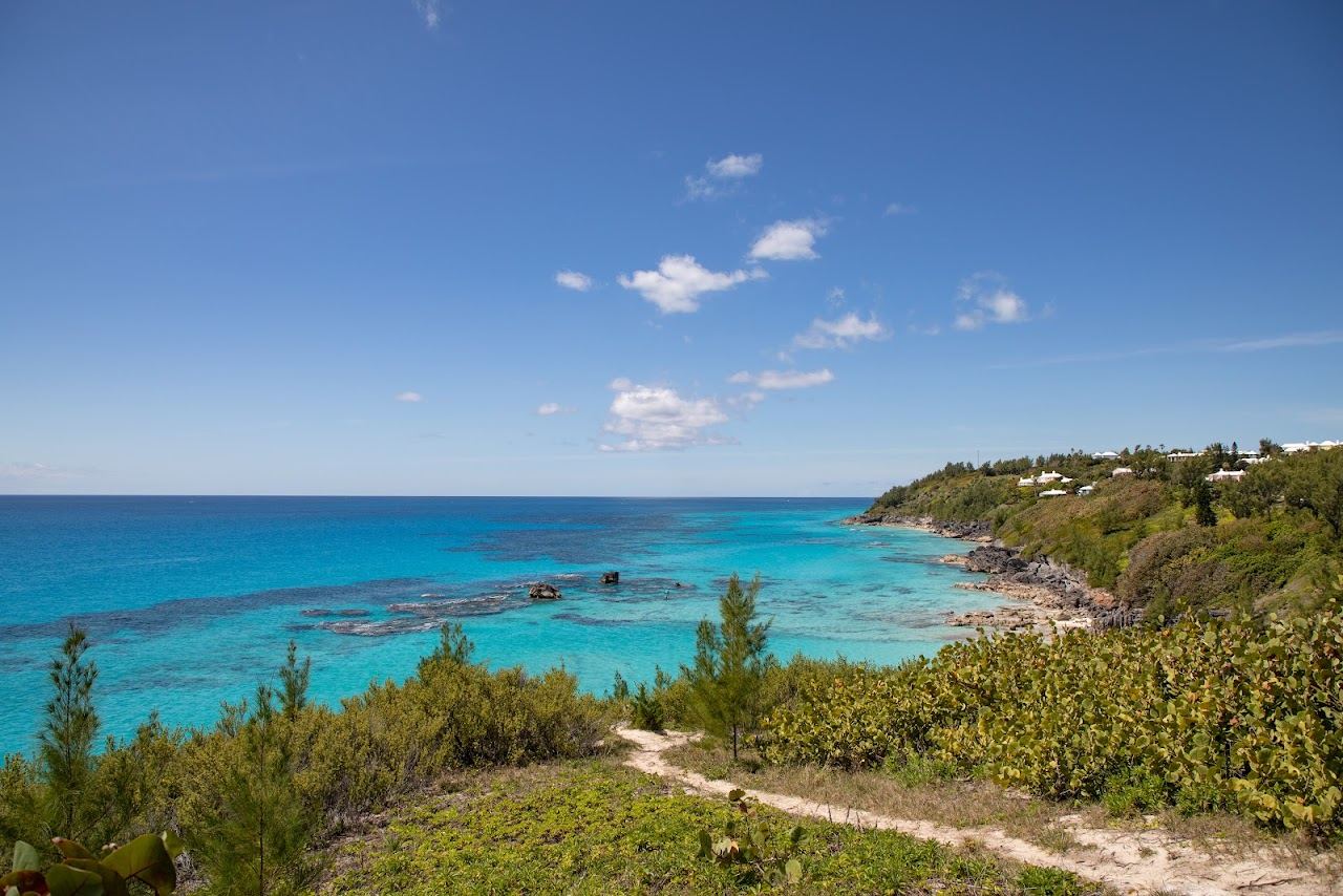 The small pink sand cove and clear reef water of Church Bay in Southampton, Bermuda