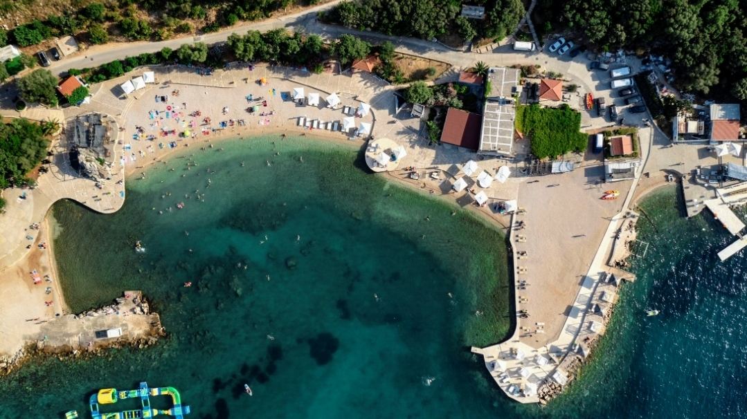 Reserved beds and canopies of the Copacabana Beach club on the Babin Kuk shore in Dubrovnik