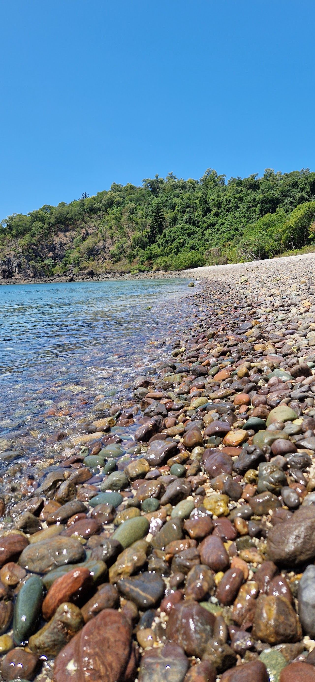 Clear water and Whitsunday Passage view from Coral Beach in Conway National Park in the Whitsundays