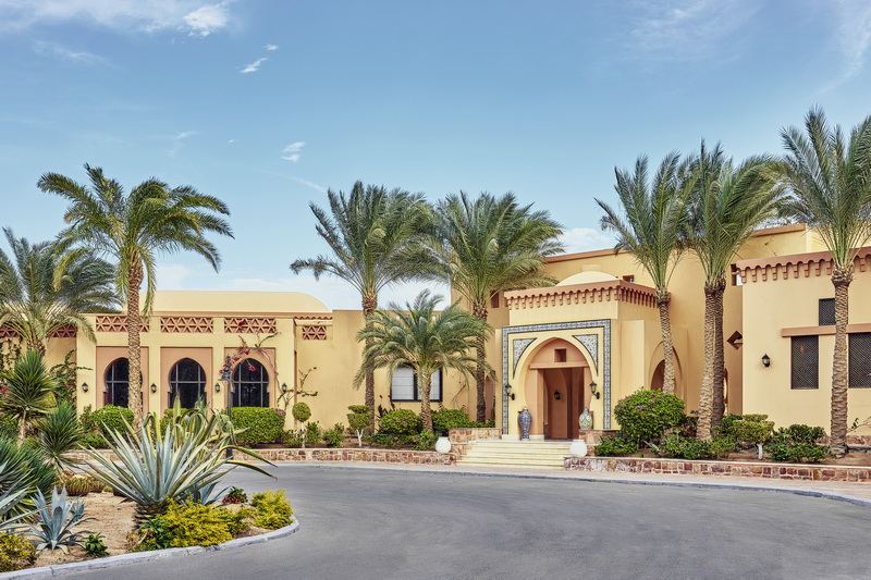 The groomed sand, loungers and calm bay of the Steigenberger Coraya Beach resort frontage at Coraya Bay near Marsa Alam
