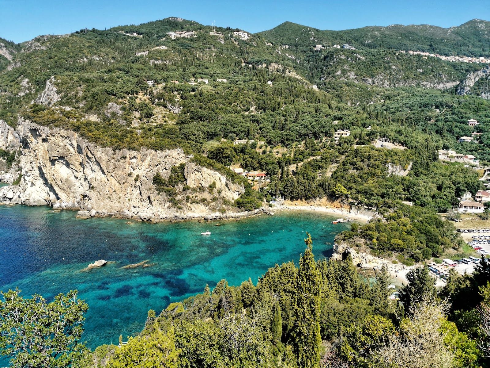 Green cliffed coves and clear Ionian water at Paleokastritsa on the northwest coast of Corfu