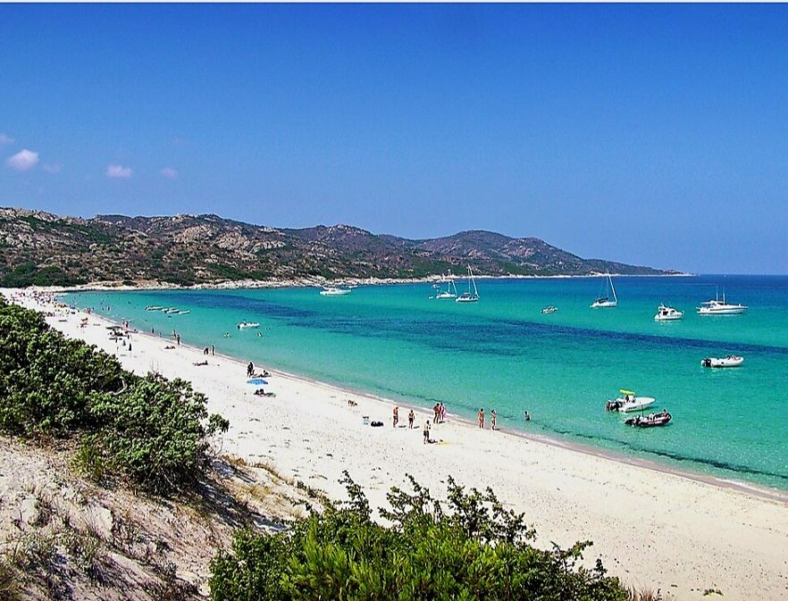 Pale white sand and clear turquoise water at the remote Saleccia beach in the Agriates desert of Corsica