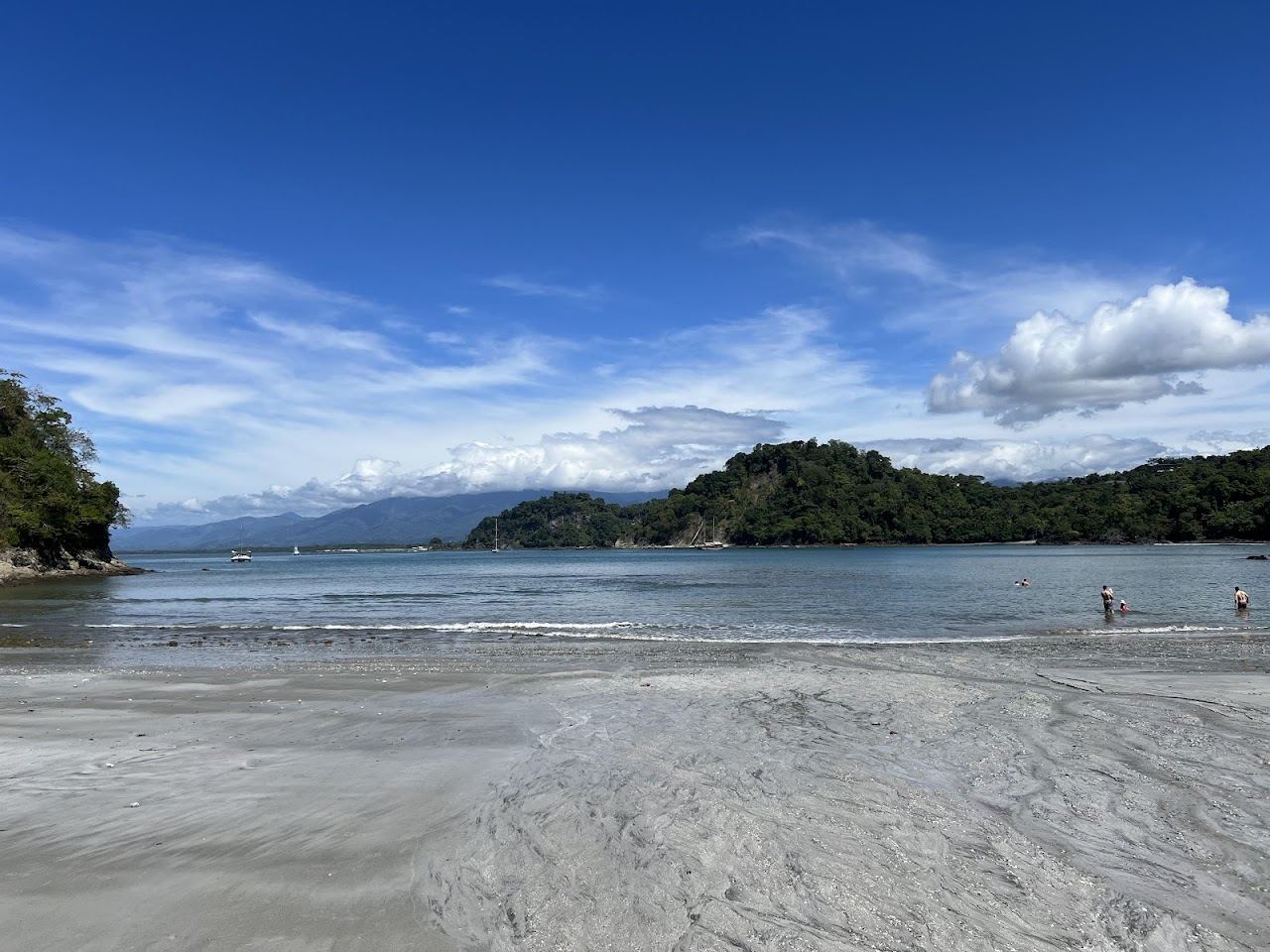 A small calm cove with clear water tucked into the forest at Playa Biesanz near Manuel Antonio