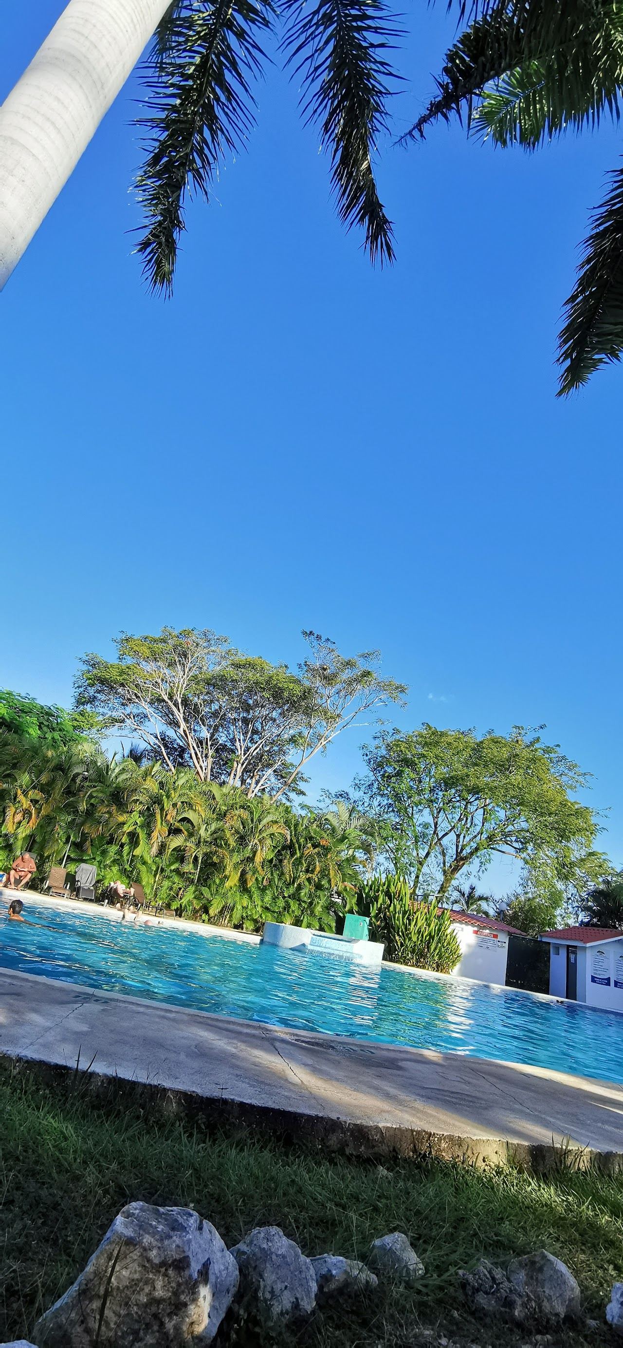 A calm pale sand bay with clear water and headlands at Playa Flamingo in Guanacaste