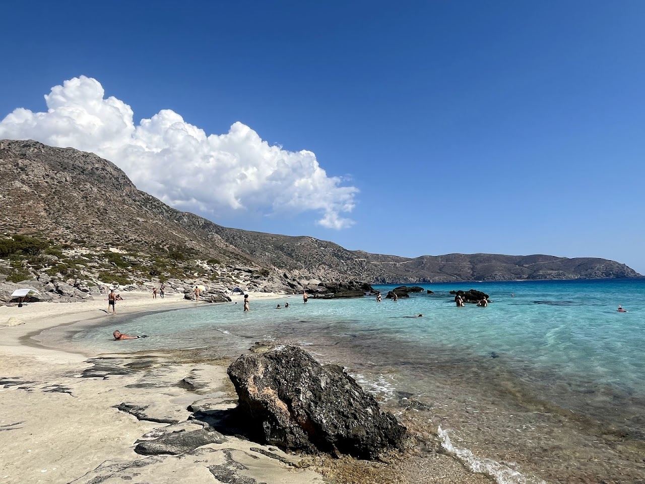 Wild juniper trees and clear water at free Kedrodasos beach in southwest Crete