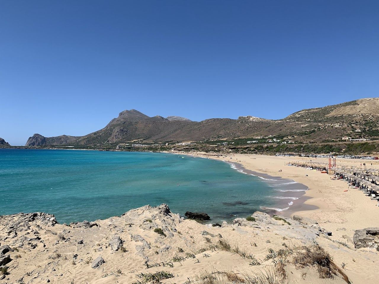 Evening light over the broad west facing sand and open sea at Falassarna beach in western Crete