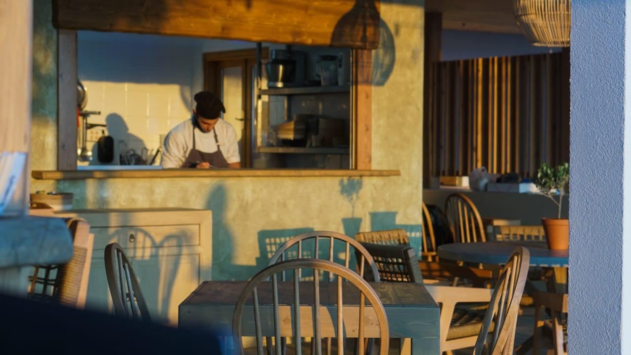 Sunbeds and cabanas at a beach club on the wide sands of Falassarna in western Crete