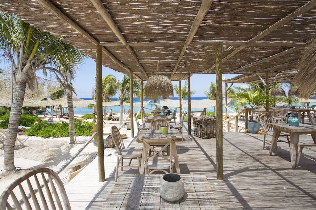 Relaxed boho terrace and loungers at Koko's on the quiet end of Jan Thiel Beach in Curacao