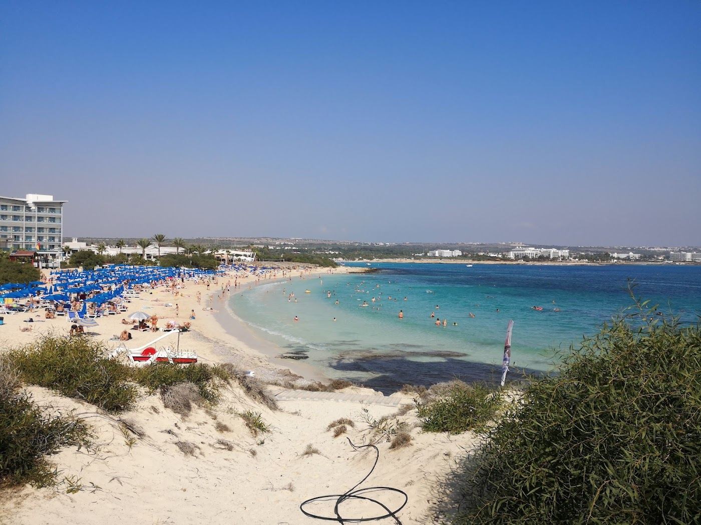 The calm sheltered bay and pale sand at Makronissos beach near Ayia Napa, Cyprus
