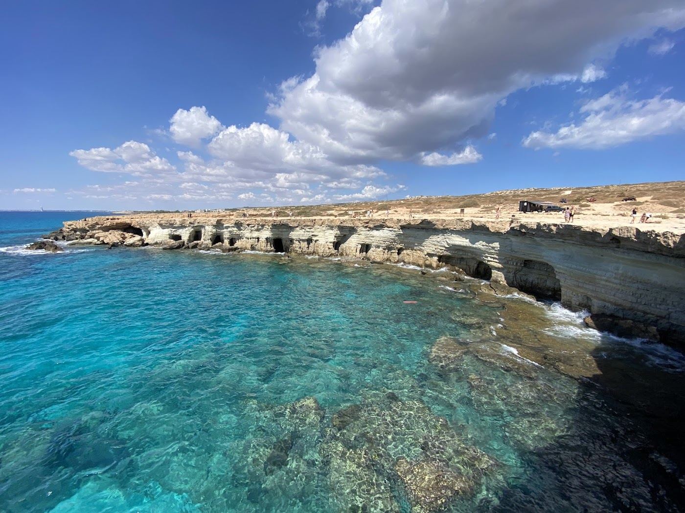 Clear turquoise water and rocky sides at Konnos Bay below Cape Greco, Cyprus