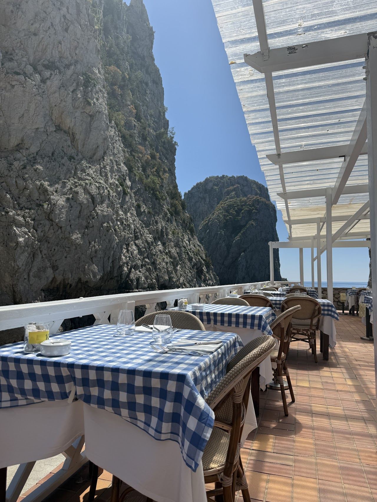 Sun platforms on the rocks at Da Luigi ai Faraglioni beneath the Faraglioni in Capri