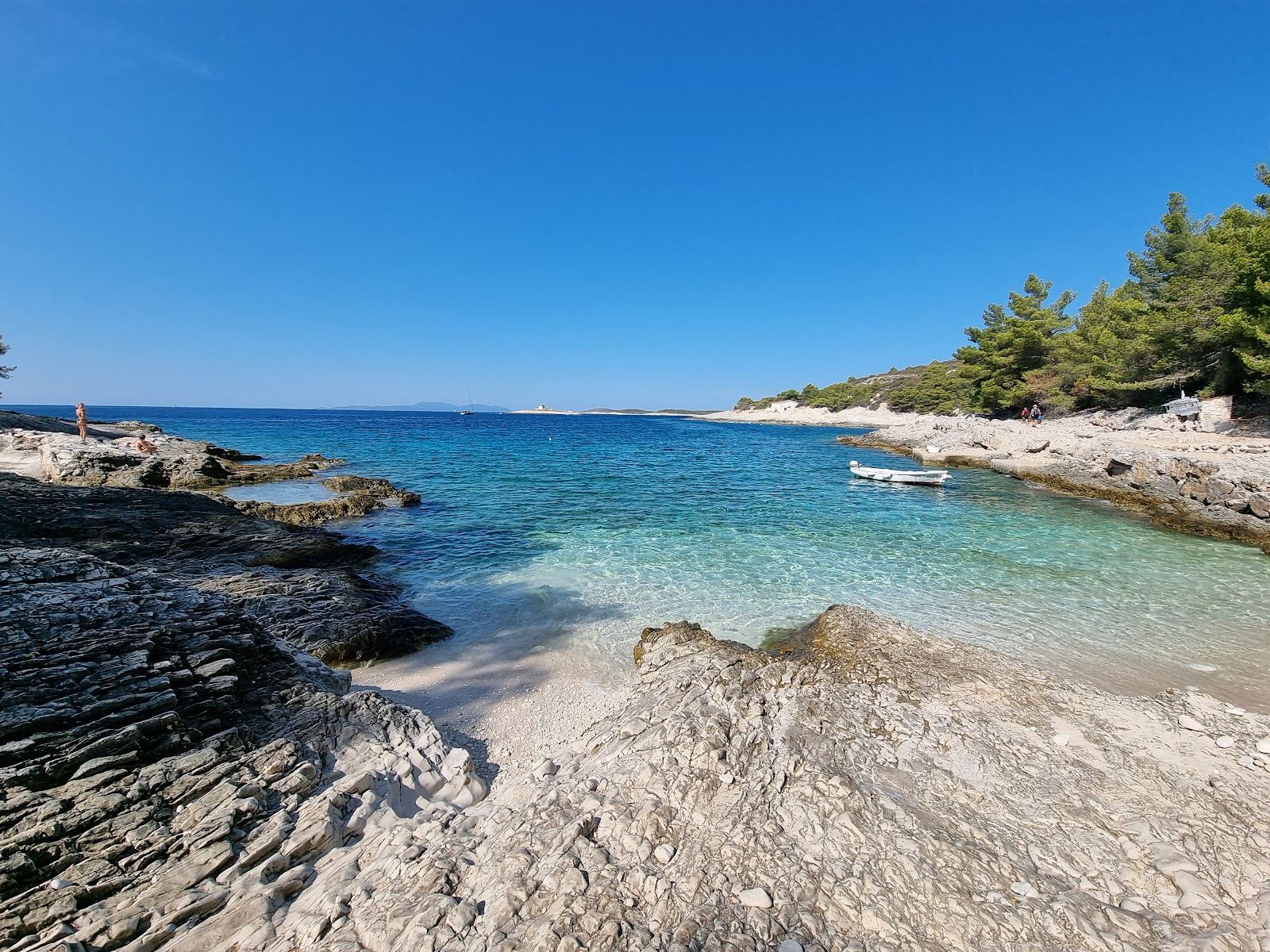 Clear Adriatic water and a pebble beach on the Dalmatian coast of Croatia