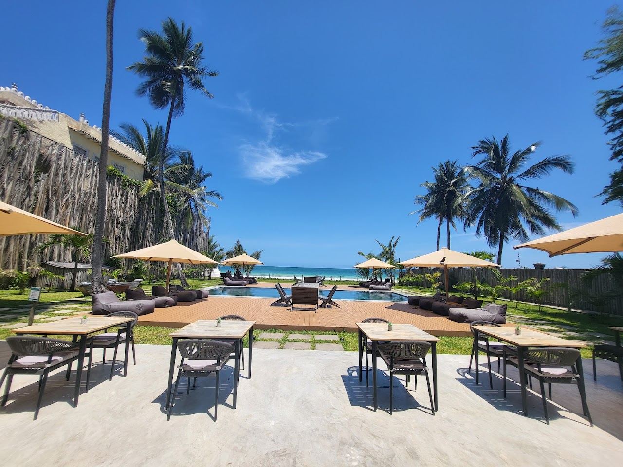 White sand and turquoise water along Galu Beach in Diani