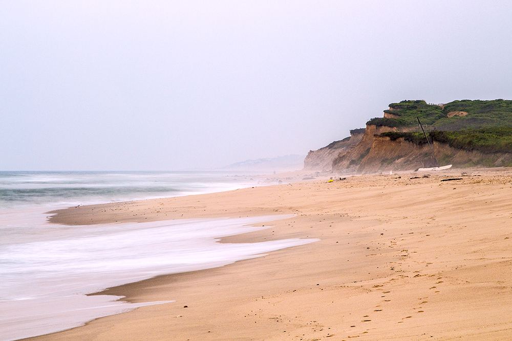 The surf and low bluffs at Ditch Plains Beach in Montauk
