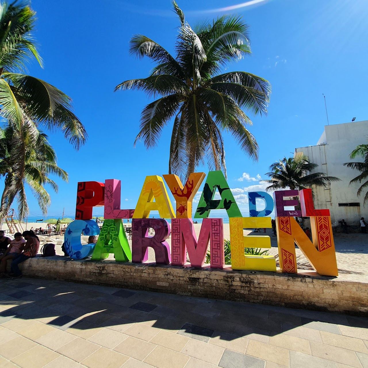 A walkable town beach with calm Caribbean water and cafes nearby at Playa del Carmen Mexico