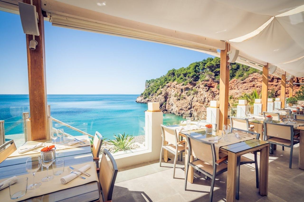 Cliffside terrace above the cove at Sol d'en Serra, Amante Ibiza