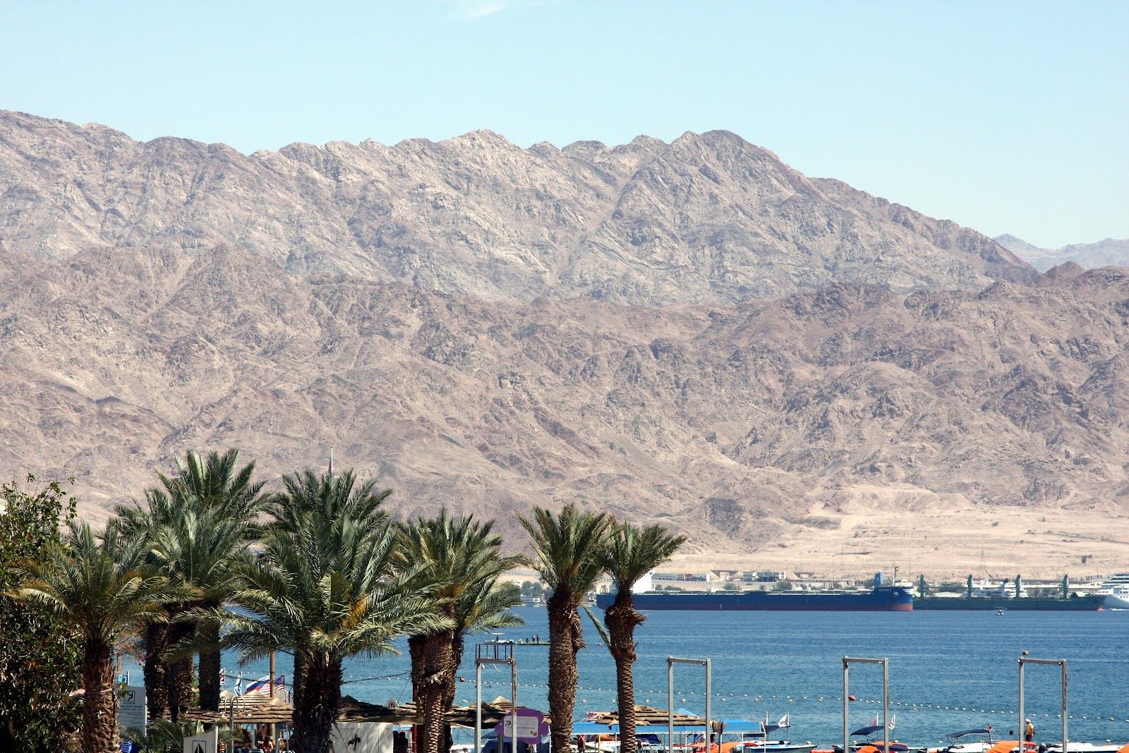 The cafe lined promenade and calm Red Sea water along North Beach in Eilat, Israel