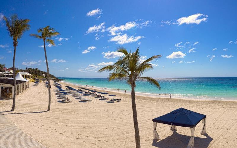 The long curve of pink sand and calm turquoise water at Elbow Beach in Paget, Bermuda