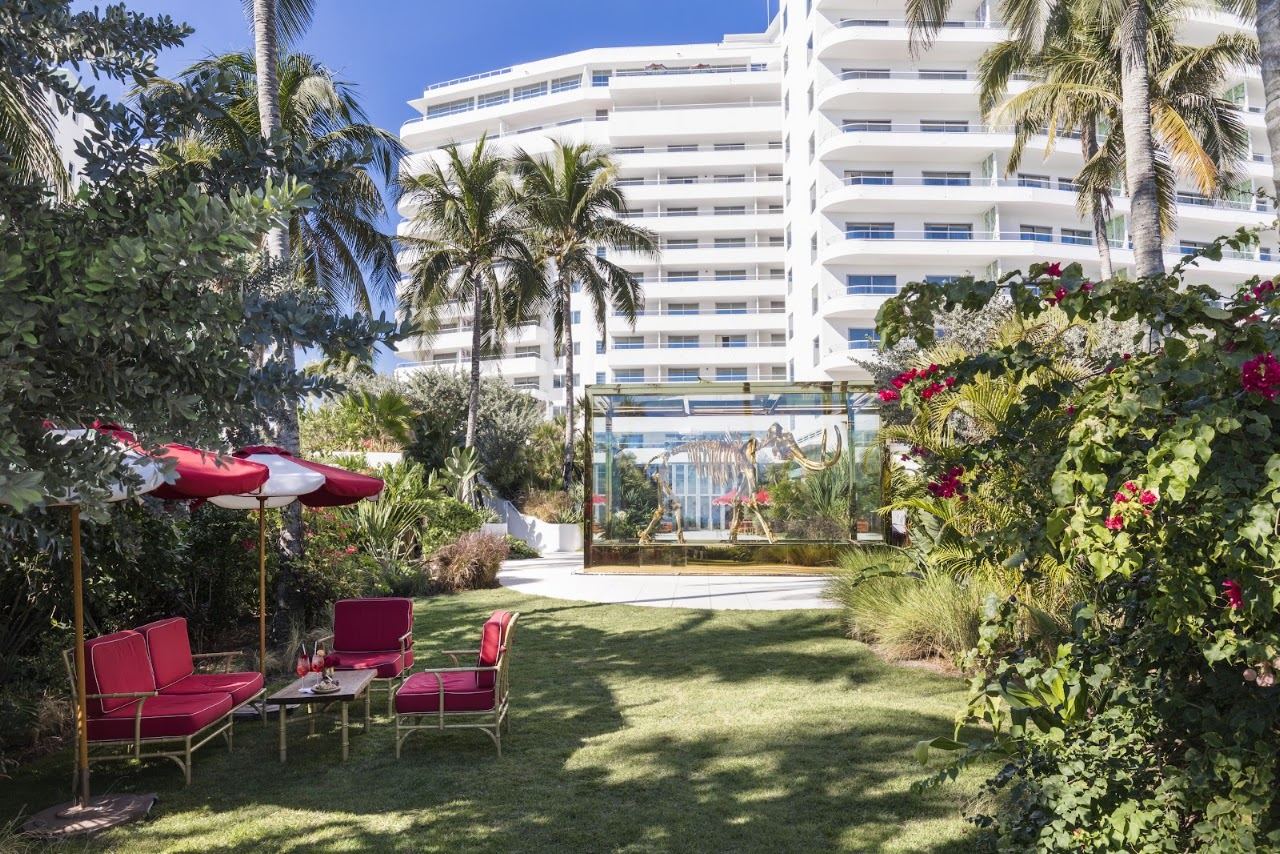 Groomed Atlantic sand and the Faena Hotel behind the beach at Mid Beach in Miami Beach