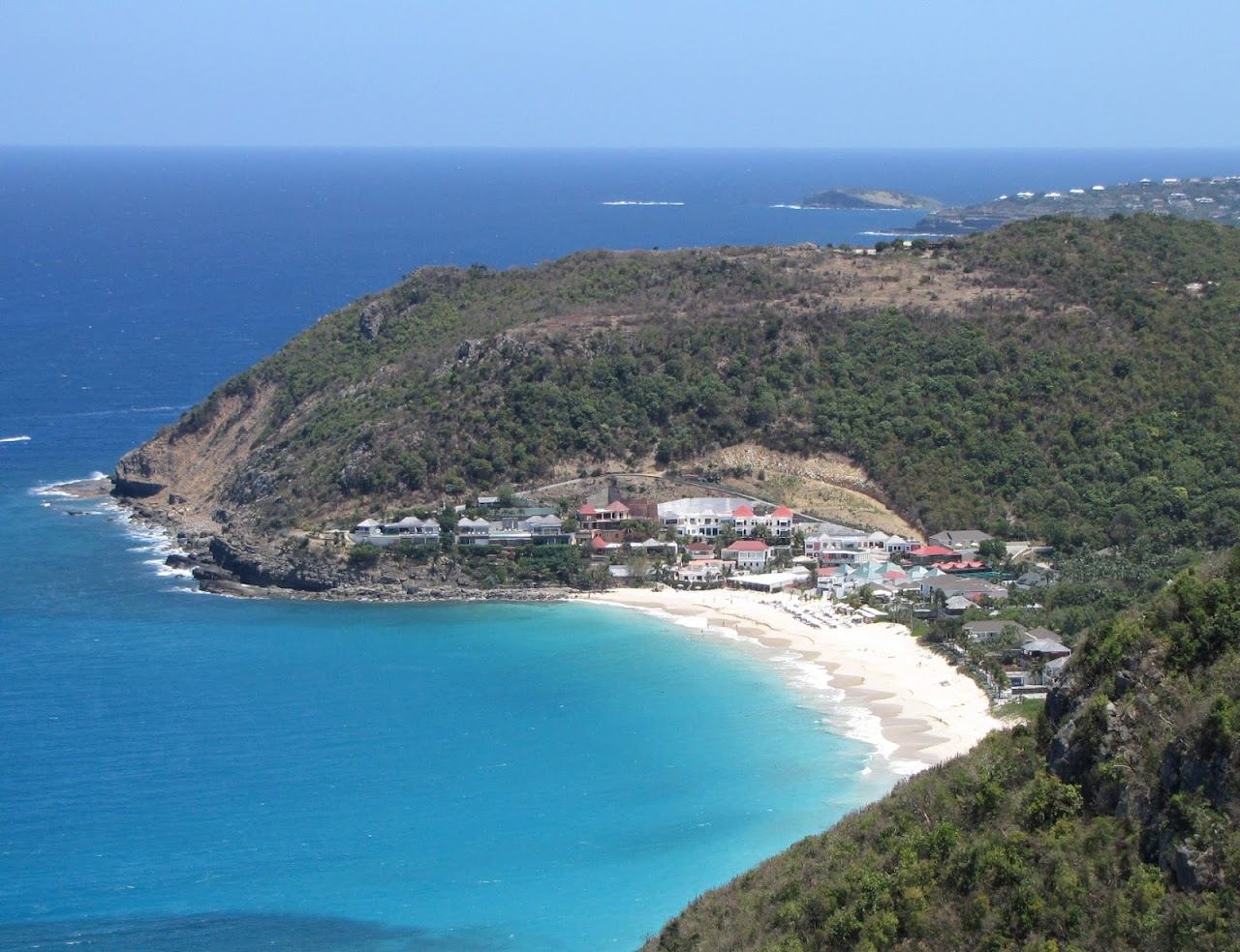 The wide pale sand and open sea of Anse des Flamands on the northwest coast of St Barths