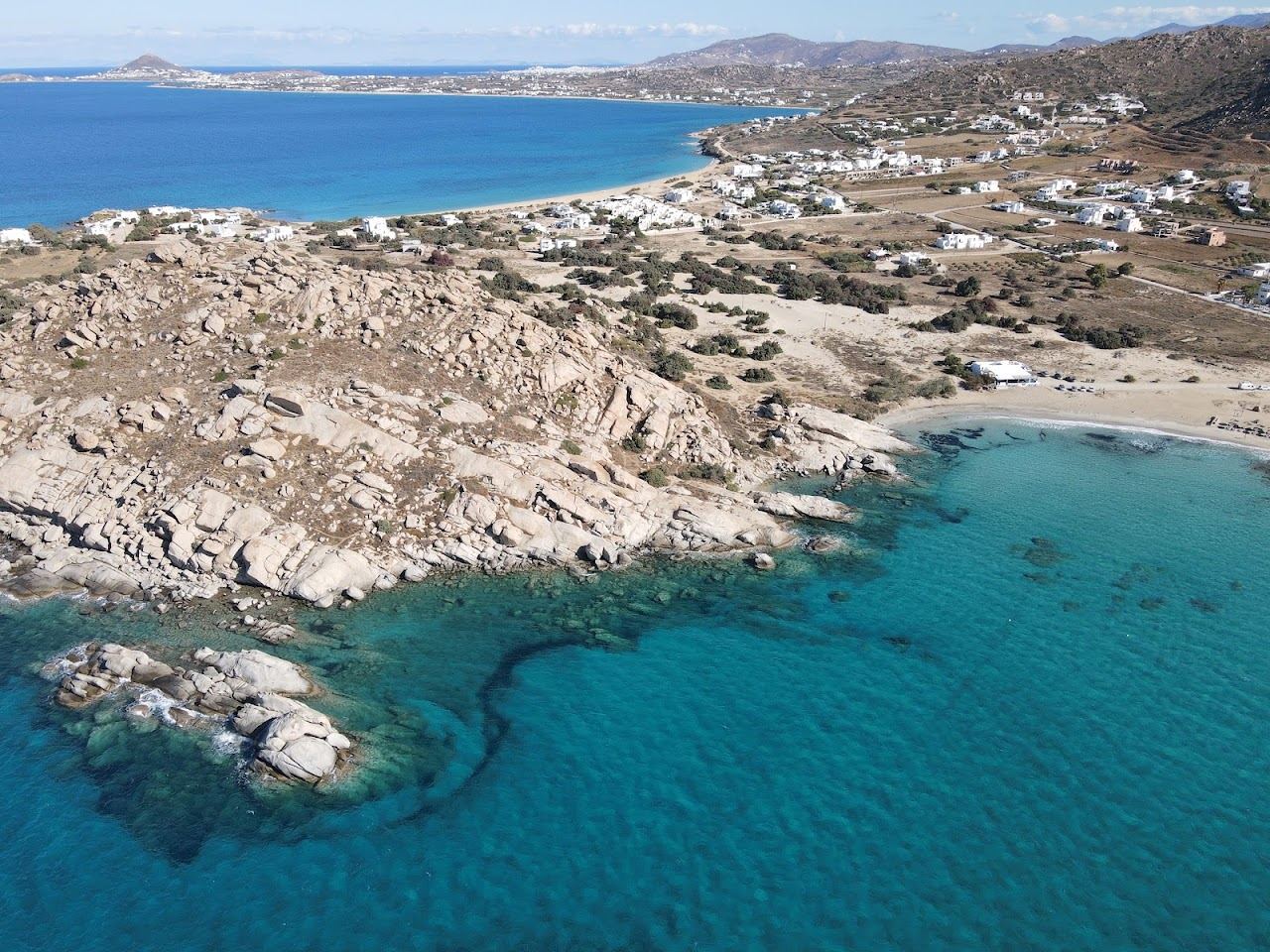 The long sandy bay and headland at Mikri Vigla on the southwest coast of Naxos