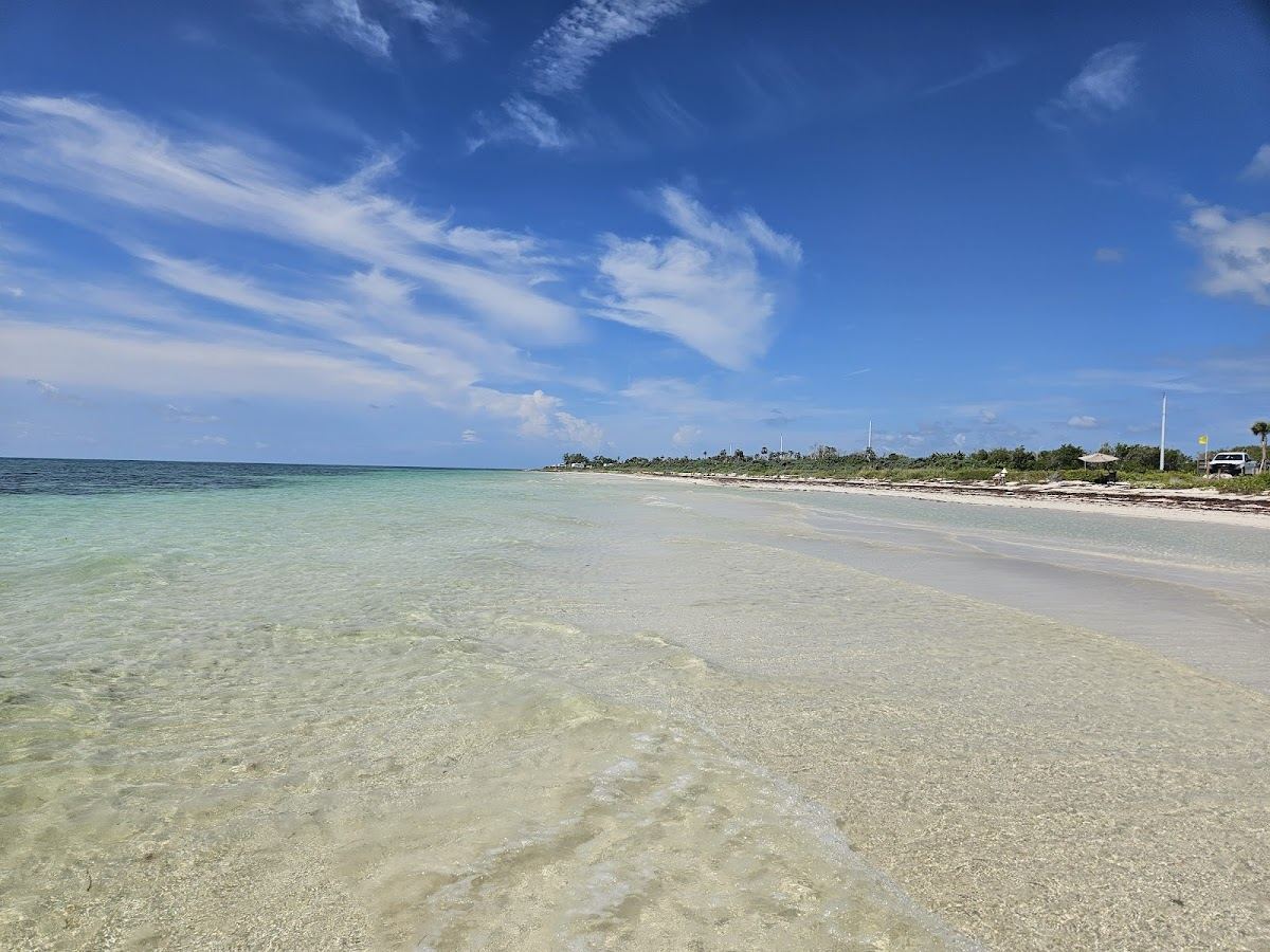 The fine soft sand and turquoise shallows along the wild end of Sandspur Beach at Bahia Honda