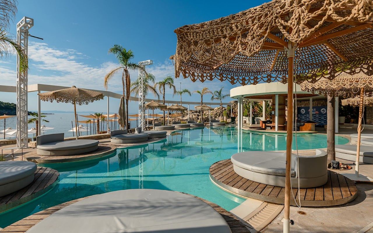 A large pool with its own bar terrace overlooking the sea at Folie Marine on Jale beach Albania