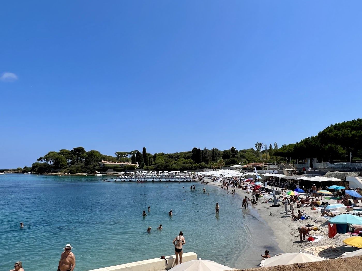 Clear turquoise water over rocks at a sheltered cove on Cap d'Antibes on the French Riviera