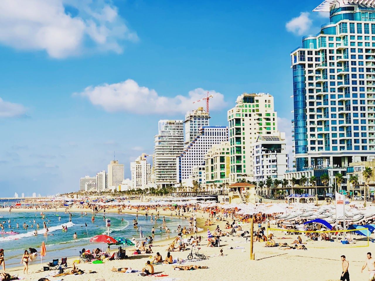 The promenade, beach bars and soft sand of Frishman beach in central Tel Aviv