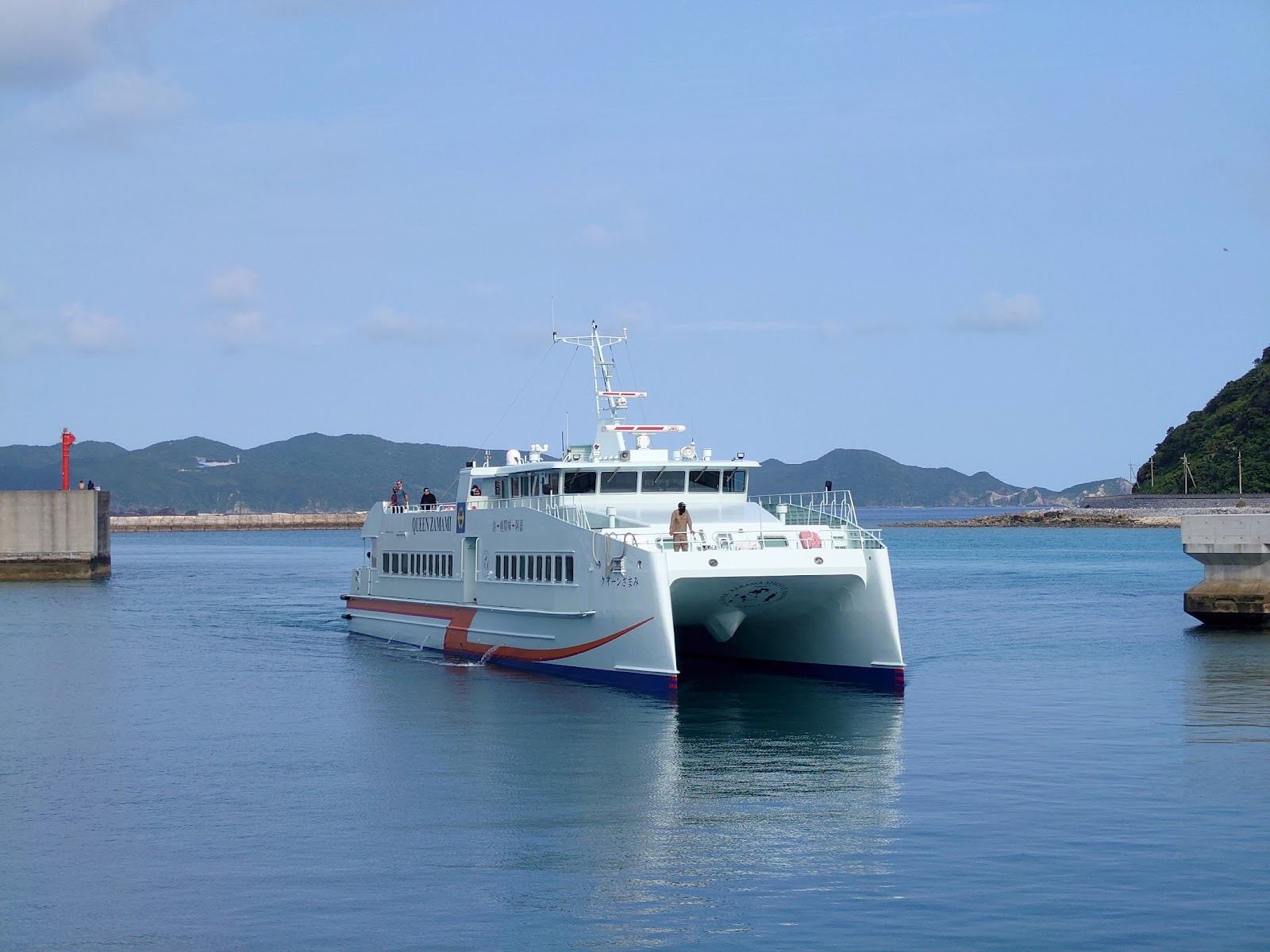 The port and green hills of Zamami Island in the Kerama group of Okinawa