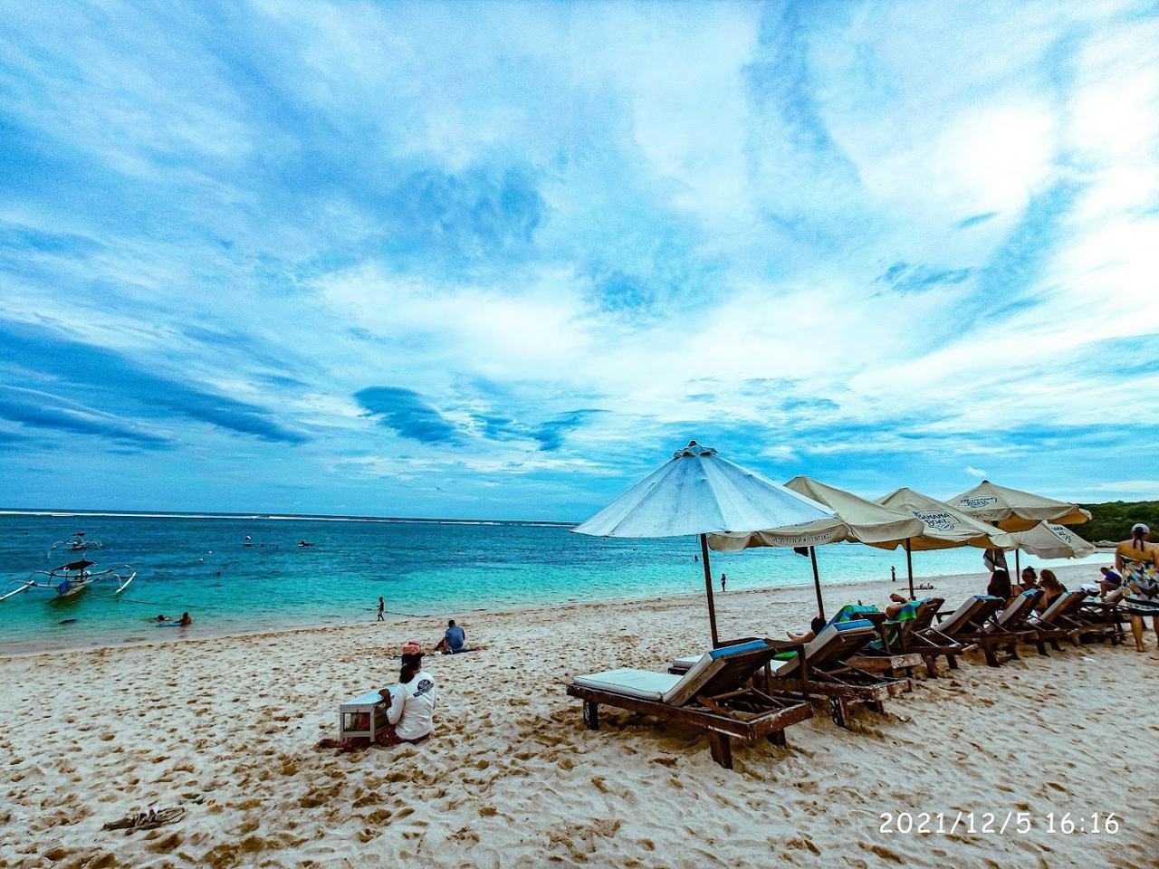 White sand and calm reef sheltered water at Geger Beach below the temple in south Bali