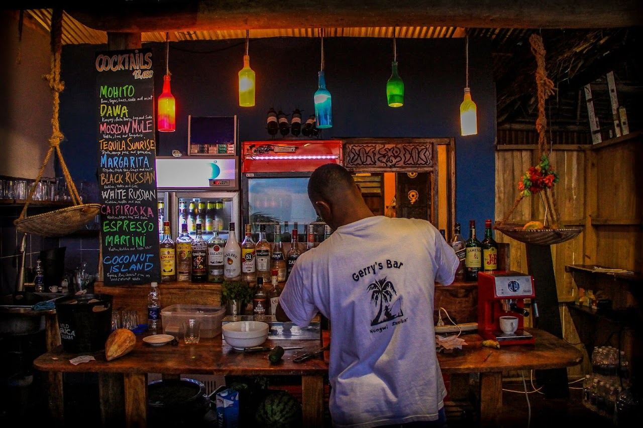 The beachfront bar and palm shaded sand at Gerry's Bar on Nungwi Beach, Zanzibar
