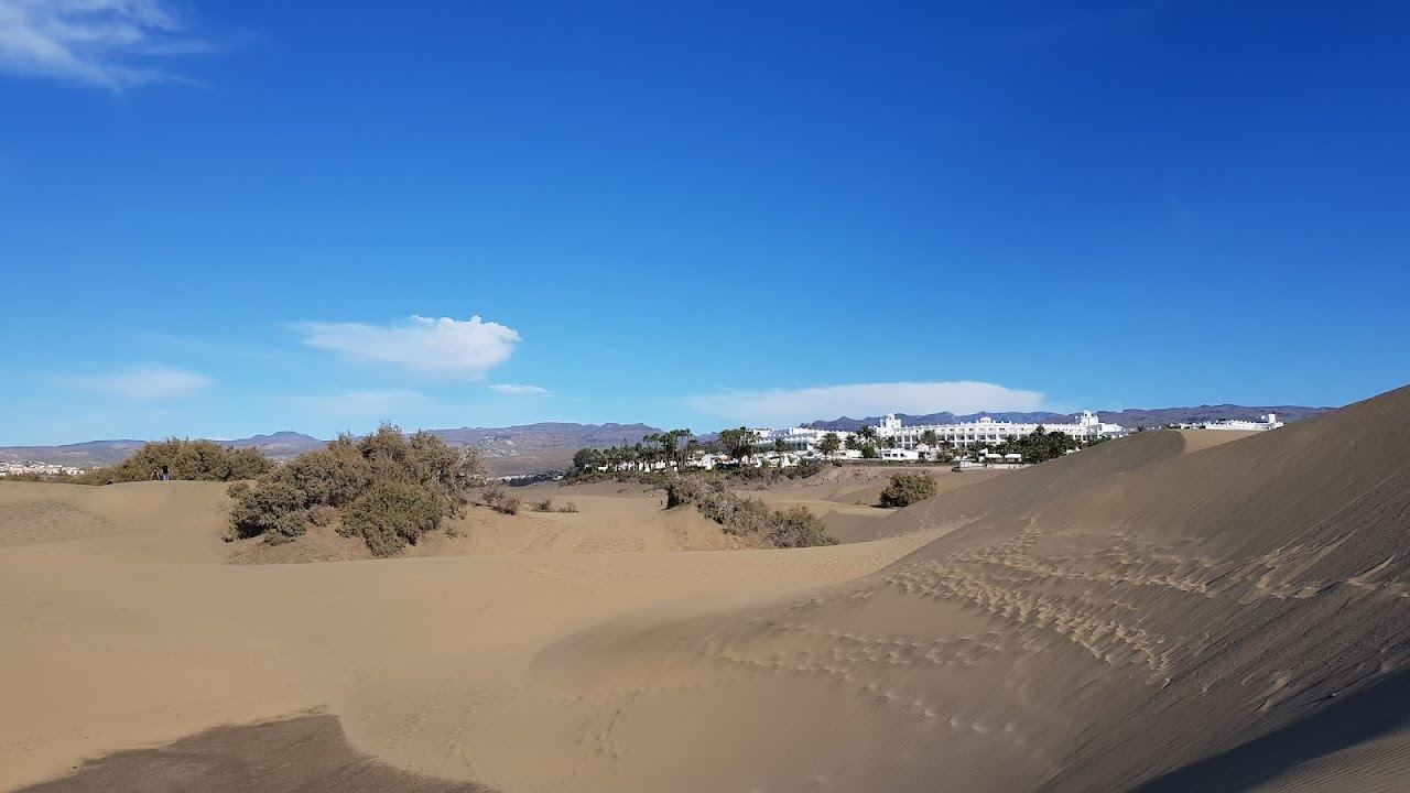 The long golden beach and dunes behind Playa del Ingles in southern Gran Canaria