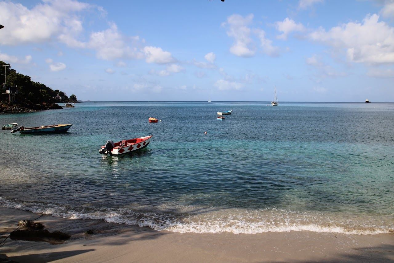 Calm leeward water and the green hills behind Grand Mal Bay on the west coast of Grenada