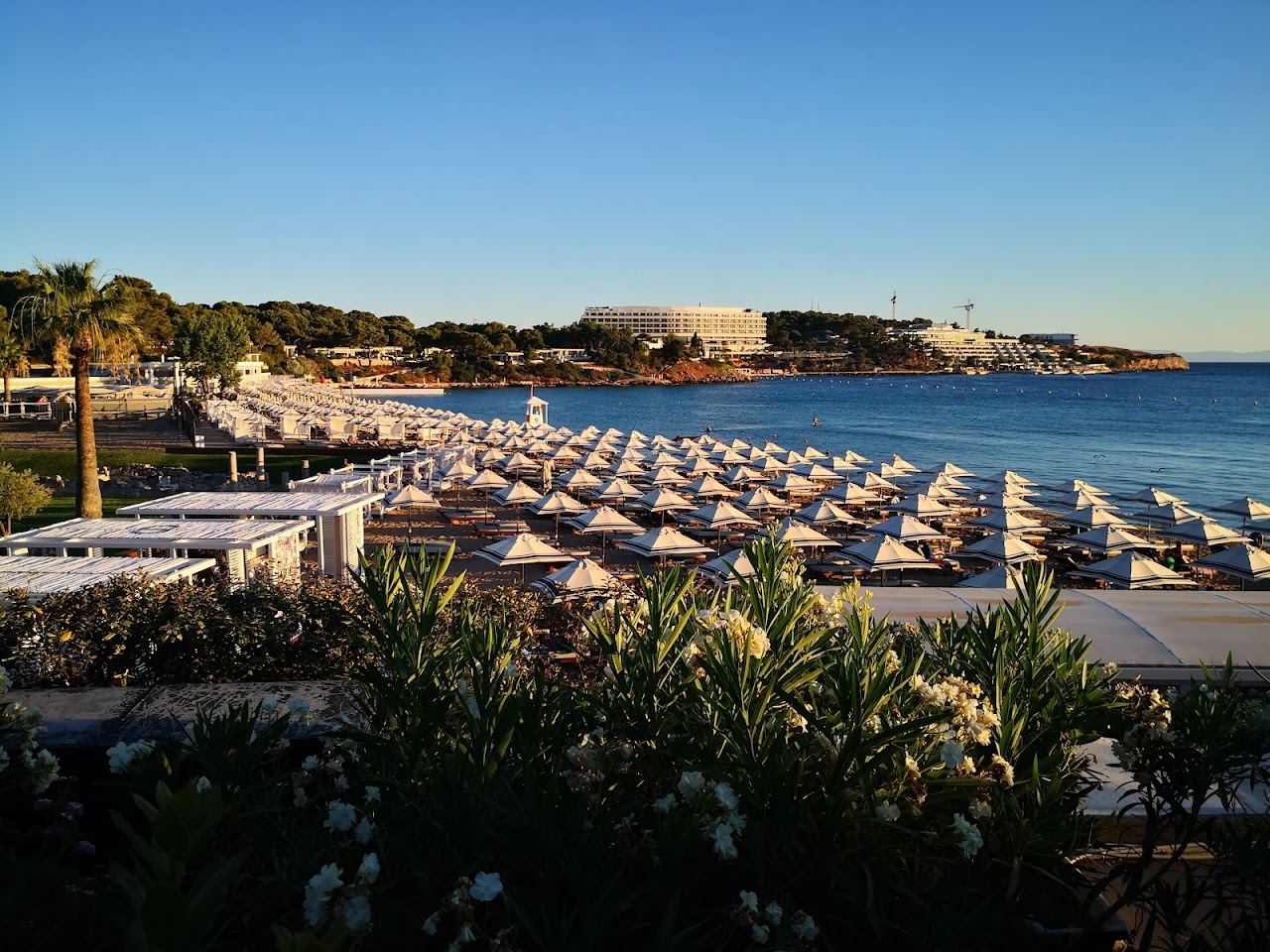 An organised beach with sunbeds and clear water at Astir Beach in Vouliagmeni on the Athens Riviera