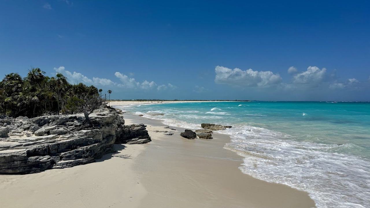 Half Moon Bay crescent sandbar and clear turquoise water between two cays near Providenciales