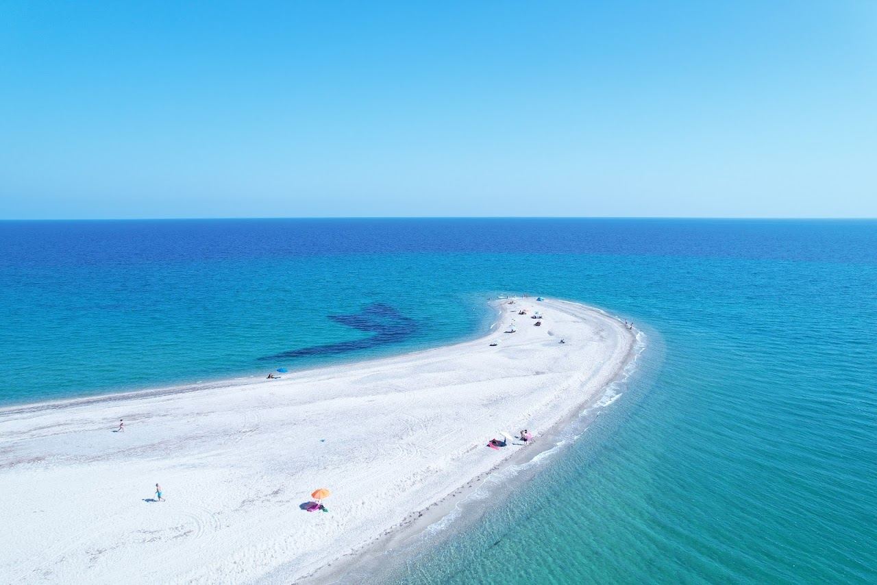 Golden evening light over the sandbar and gulf water at Cape Possidi on the Kassandra peninsula of Halkidiki