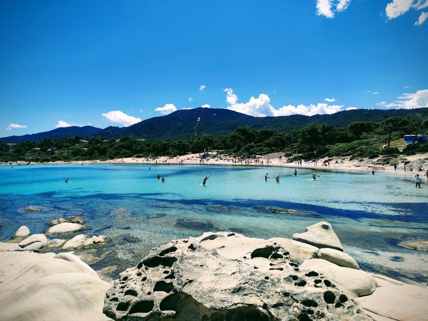 Calm clear water and pale sculpted rock at Karydi beach near Vourvourou, Halkidiki