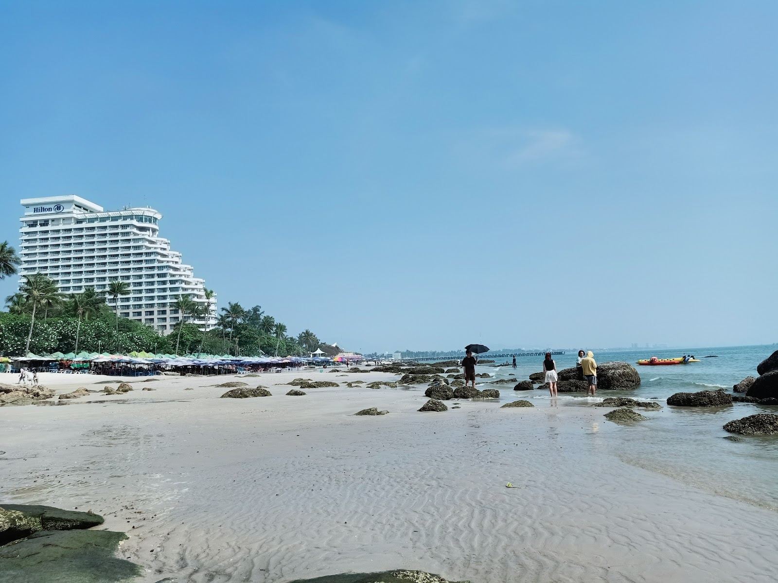 Beachfront bars and loungers along the sand at Hua Hin beach in Thailand