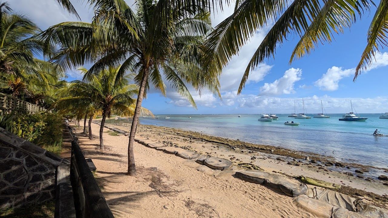The calm northern lagoon at Bain Boeuf with the island of Coin de Mire on the horizon in Mauritius