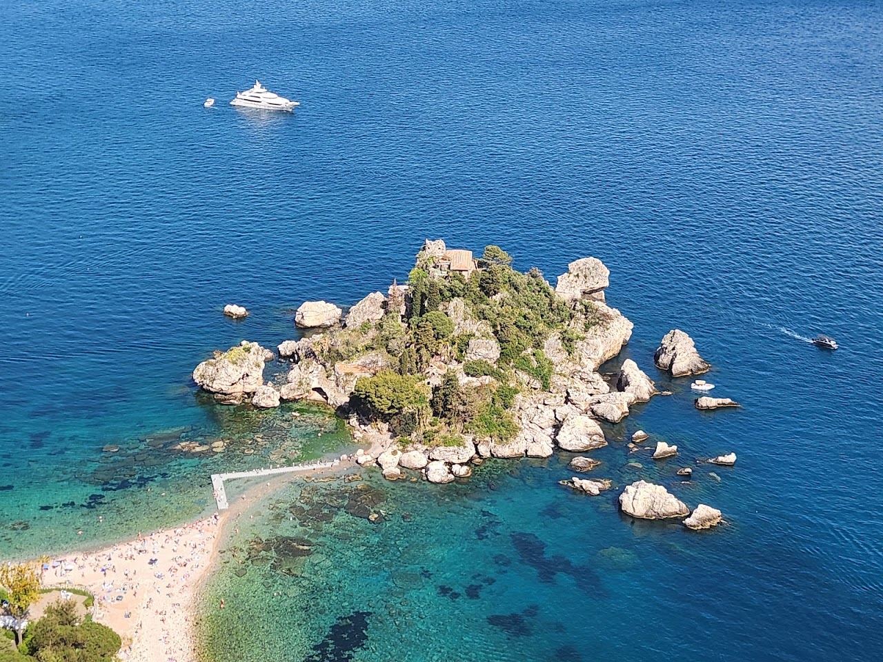 The Isola Bella islet and its causeway seen across the water south of Mazzaro