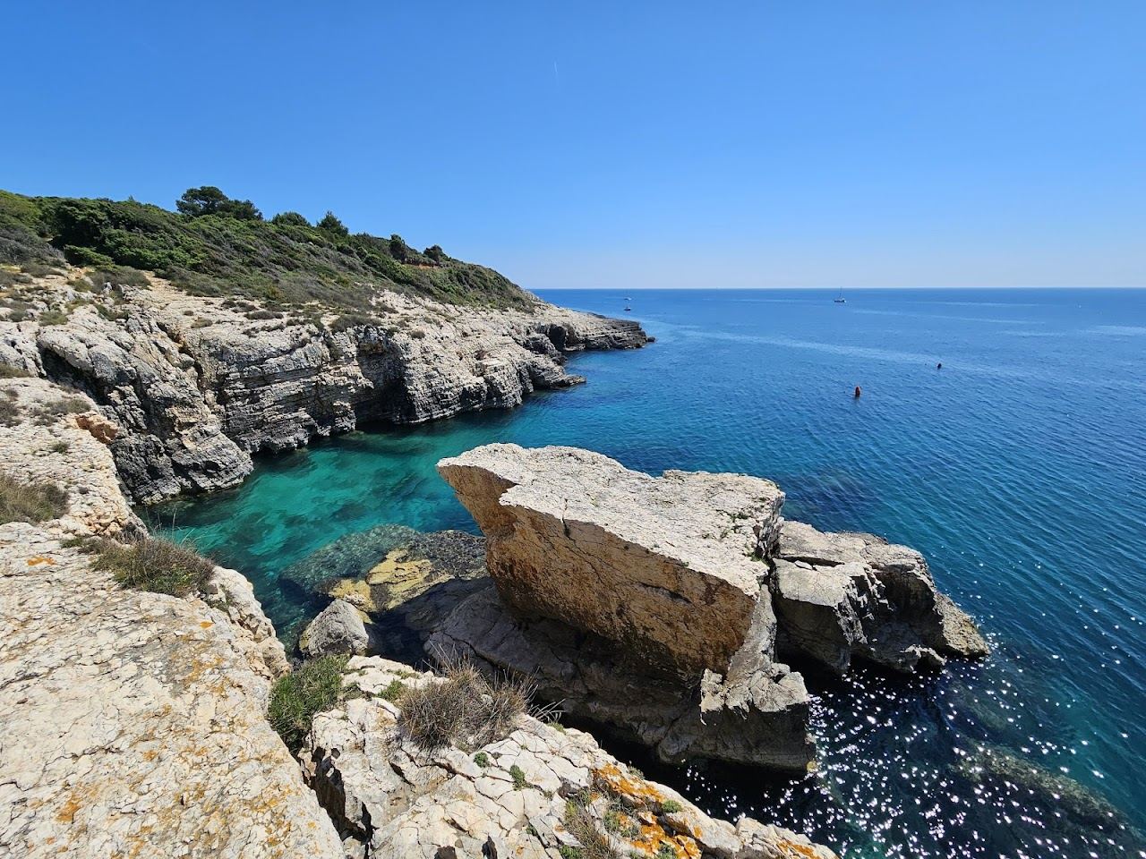 A wild hidden rock cove with clear water at Cape Kamenjak near Premantura in southern Istria