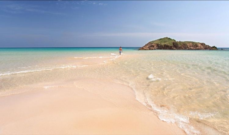 Su Giudeu in Chia, Sardinia with clear water and sand