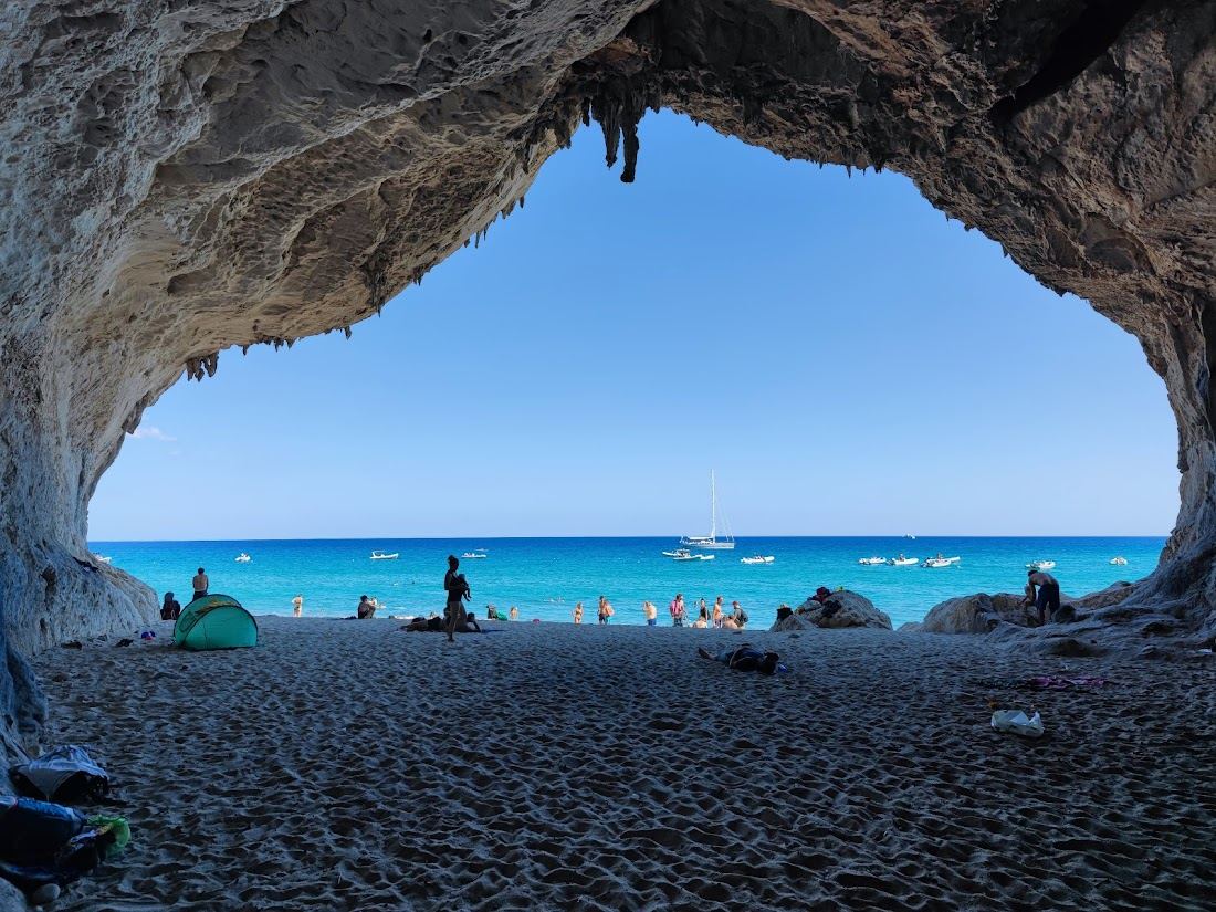 Cala Luna in Gulf of Orosei, Sardinia with clear water and sand