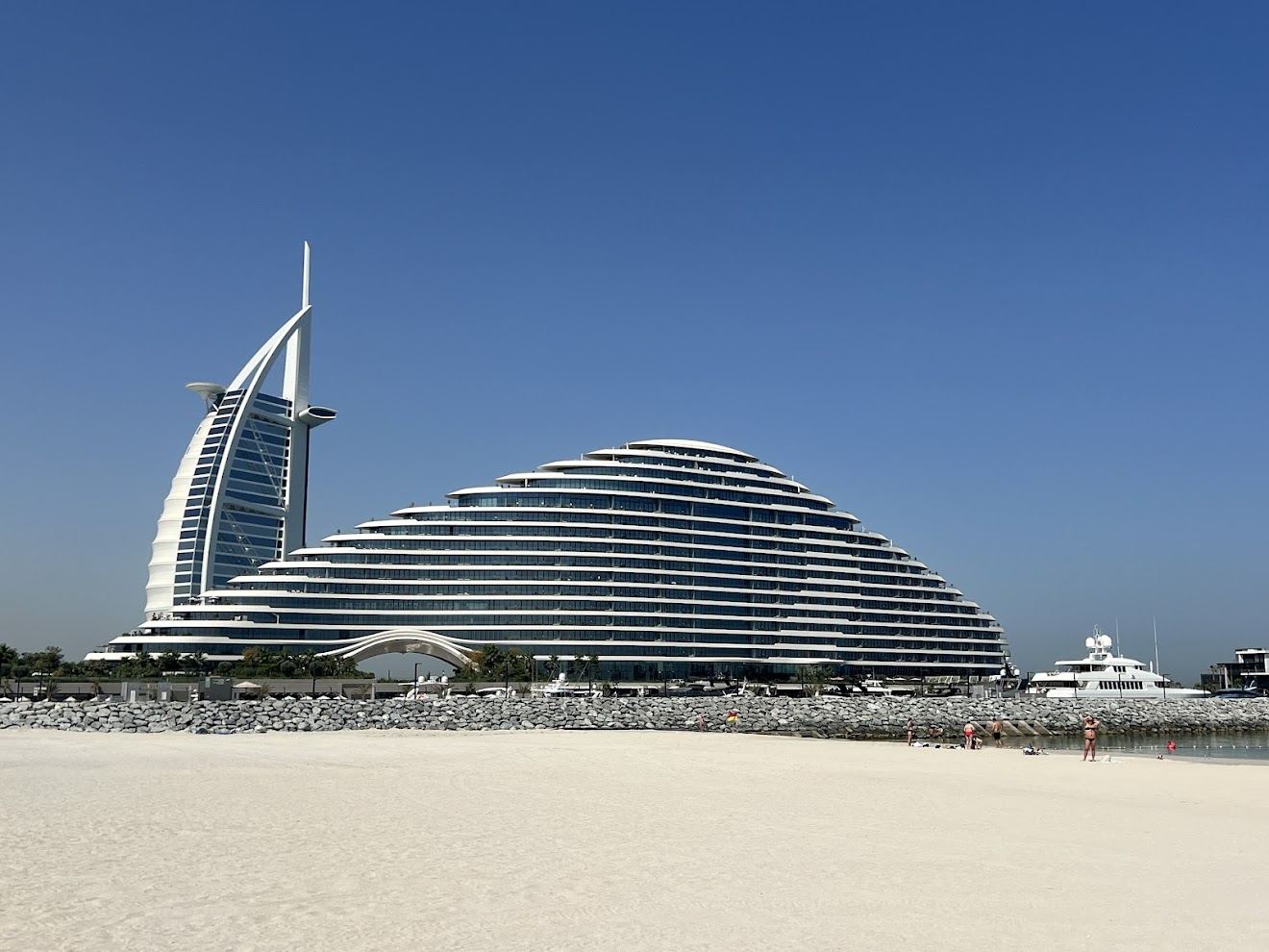 Soft white sand and calm shallow Gulf water along Jumeirah Beach in Dubai