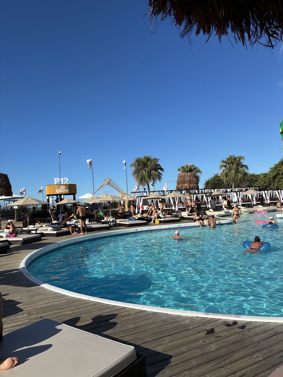 Pool, cabanas and seafront deck at the P12 beach club on Jurere Internacional in Florianopolis Brazil