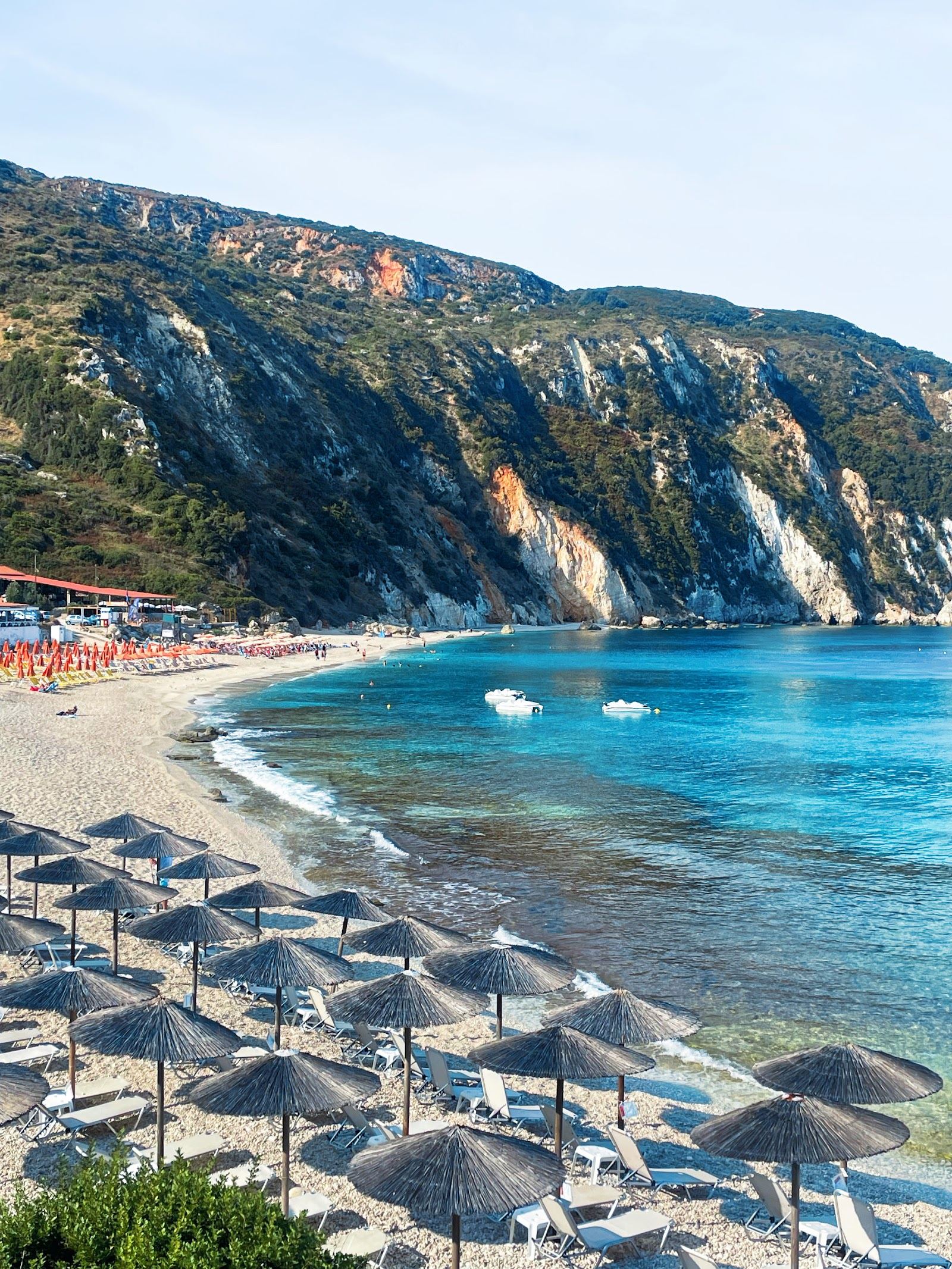 Evening light over the cliff backed west facing bay of Petani on the Paliki peninsula in Kefalonia